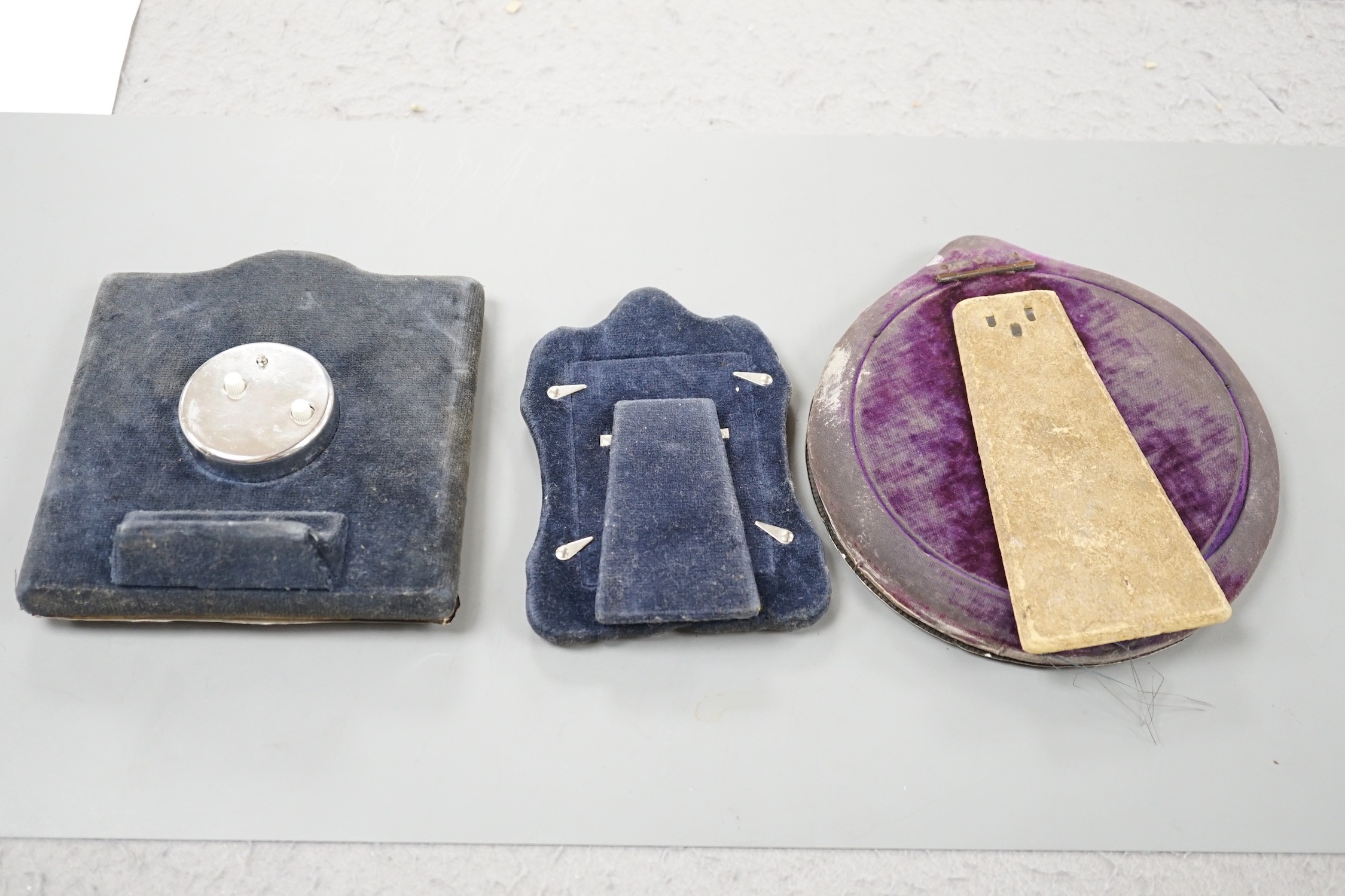A modern silver mounted desk timepiece, 15.2cm and two mounted photograph frames, including Italian 925 and Edwardian repousse.